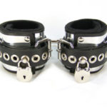 Axovus metal band cuffs feature neoprene padding, latigo leather and a full-width aluminum band for a distinctive look
